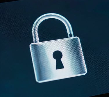 A close-up of a secure, shining padlock icon on a digital screen, emphasizing data protection and safety, in dark charcoal blue and deep teal tones.