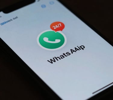 A close-up of a smartphone displaying a chat application with a notification icon, representing 24/7 WhatsApp support, in deep teal and mist blue colors.