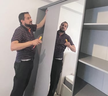 a man a man assembling wardrobe