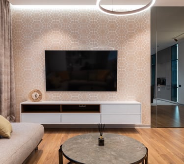 a living room with a television and a couch