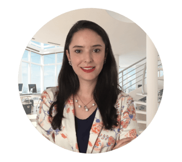 a lawyer woman in a floral jacket and necklace