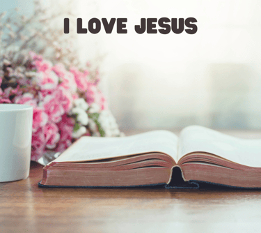 bible on table with pink flowers