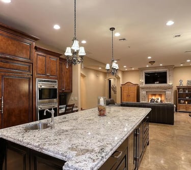 Custom kitchen remodel with oversized island and pendant lighting
