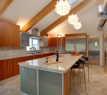 Custom kitchen remodel with oversized island and pendant lighting