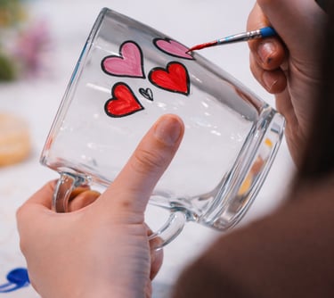Glass painting hen party workshop with guests decorating glassware together