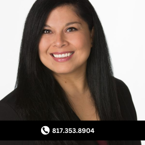 a woman with long black hair and a black jacket