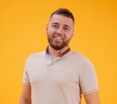 a man with a beard and a beard, smiling