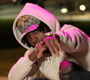 Malik in a hoodie and a pink hoodie