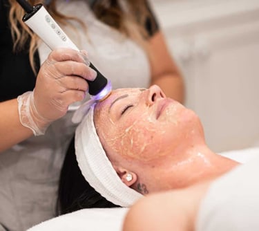 Woman receiving oxygeneo facial treatment in Vadodara for skin rejuvenation, glow facial, by best dermatologist