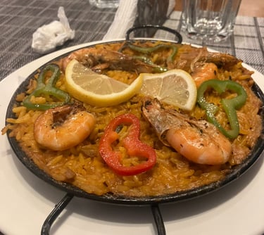 a pan of food with a lemon slice on top of it - halal food 