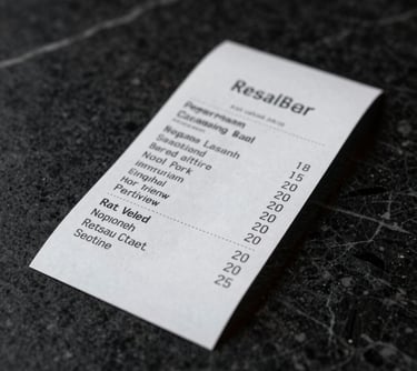 A minimalist, artistic shot of a restaurant receipt placed on a black marble surface, symbolizing the proof required for a verified review.