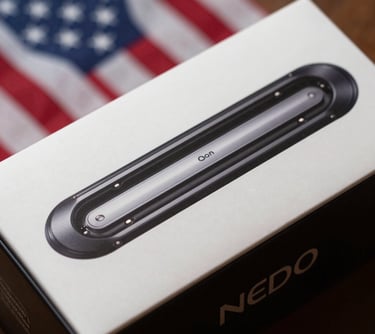 Close-up photography of a printed sleeve packaging for a luxury electronics box. The image shows the smooth sliding mechanism and the high-contrast branding, set against a professional North American backdrop.