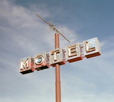 Neon motel sign on the road. 16. B&B and Small Hotel Consulting