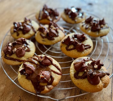 a bunch of cookies on a wire rack