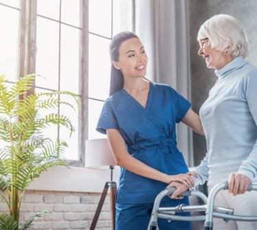 Physical therapy: performing gait training with a geriatric patient at home.
