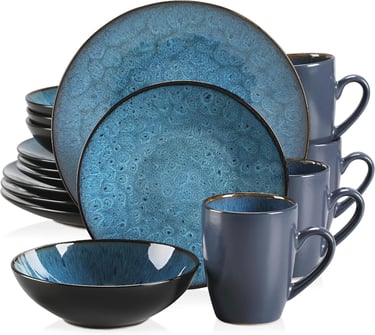 a blue dinner set with a cup of coffee and a mug
