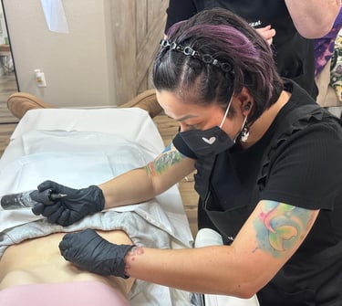Stretch mark blending tattoo procedure at EMPOWERink's Denver, CO tattoo studio