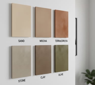 Six colorful acoustic wall panels in various shades displayed on a white wall for sound dampening.