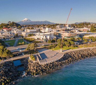 New Plymouth city skyline looking south from the foreshore with Mount Taranaki on the horizon.