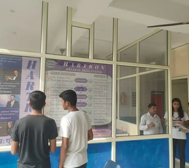 students reading Hartron poster while waiting for there next class