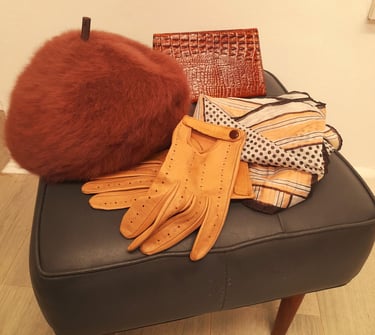 a pair of gloves and gloves on a chair