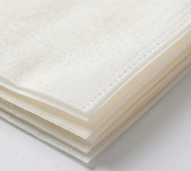 Close-up of soft, colorful hand knitting yarns neatly arranged in skeins.