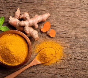 curcumin in a spoon and ginger