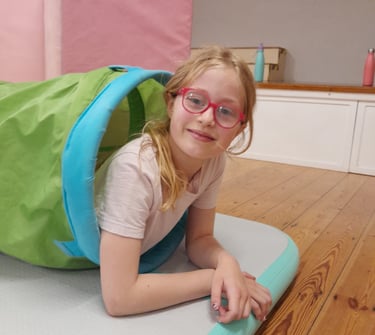 smiling girl at SEND gymnastics session