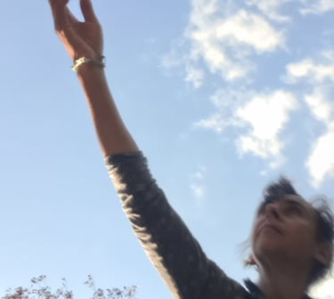 a woman reaching up