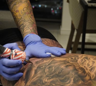 Miami tattoo studio session with a client being tattooed