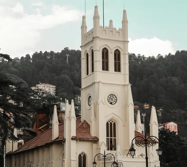 a church with a steeple and a clock tower