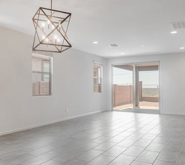 a room with a ceiling fan and a light fixture