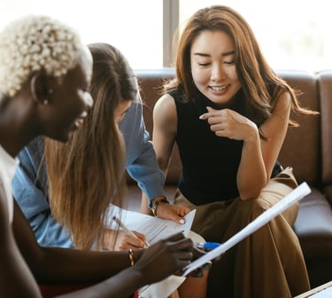 Group of multicultural women speaking and setting accountability goals