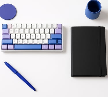 Overhead flat lay of a clean, minimalist workspace, crisp bright studio lighting, a mechanical keyboard, a matte black notebook, cool violet and cobalt accents, sharp focus, 35mm