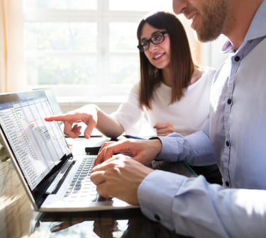Man and woman discussing data