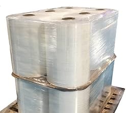 Strapping machine applying PET straps to export pallets