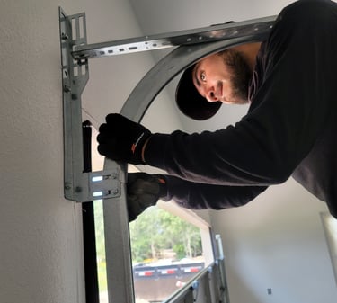 Alejandro repairing a garage door | On Point Overhead Doors - Kyle, TX