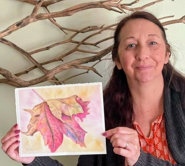 Artist holding Maple leaf finished painting