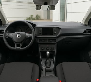 Interior de carro compacto versão PCD com câmbio automático, painel simples e acabamento básico.
