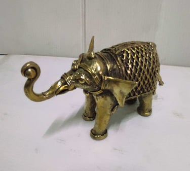 "Small brass elephant with raised trunk and intricate tribal design carvings-For international dispatch"