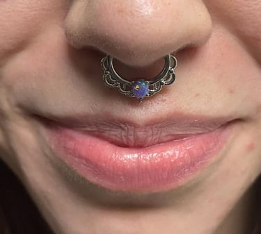a woman with a septum piercing.