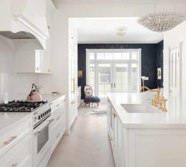 a kitchen with a white counter top and a white counter top