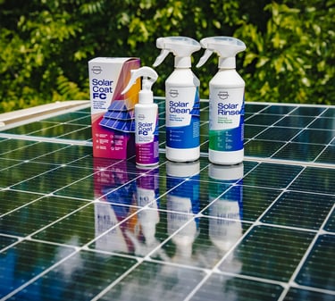 solar panel with 3 white, purple and blue spray bottles, and a box set on top of it