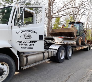 hauling backhoe to a job