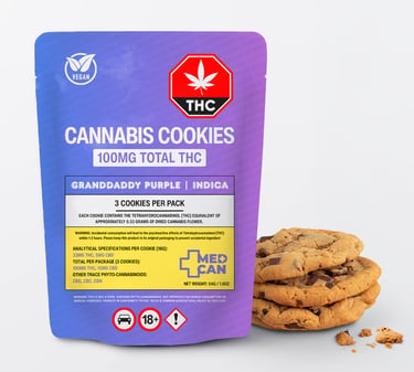 A purple pouch of Granddaddy Purple Indica cannabis cookies next to a stack of chocolate chip edibles.