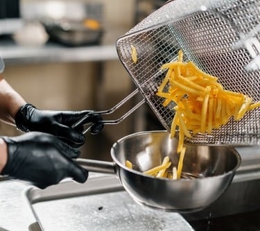 a man cooking french fries