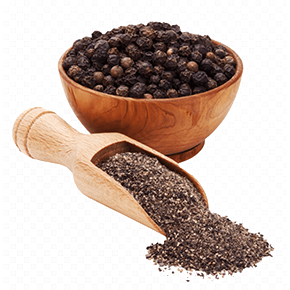 Freshly ground black pepper in a wooden scoop next to a bowl of whole peppercorns.