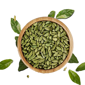 A wooden bowl filled with green cardamom pods and fresh leaves on a white background.