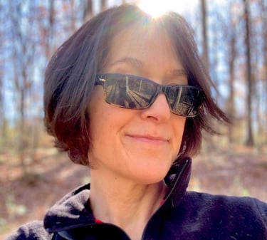 a woman in sunglasses and sunglasses talking on a cell phone