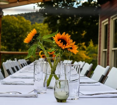 table set for guests, with daisy flowers